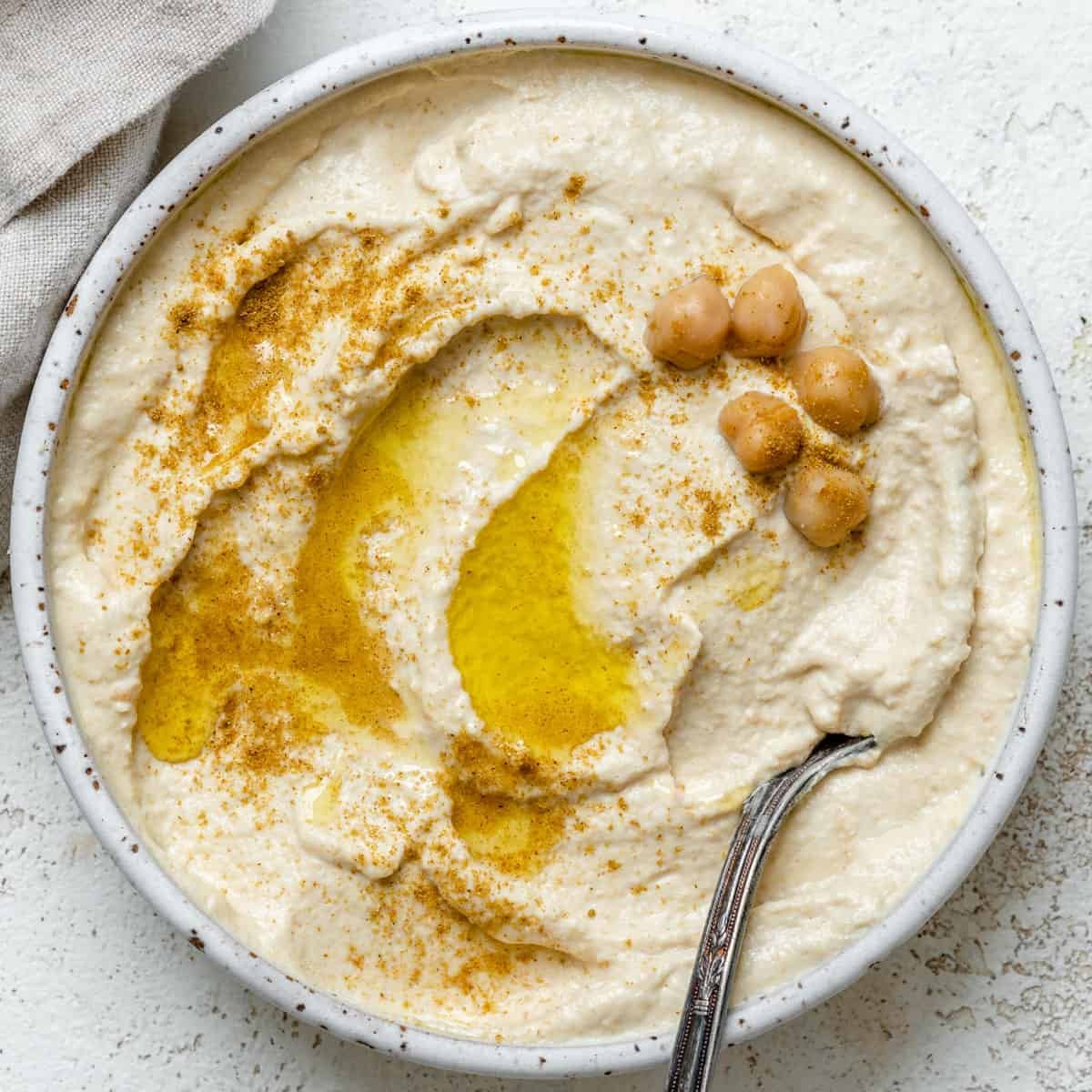 completed Easy Hummus in a bowl against a light background